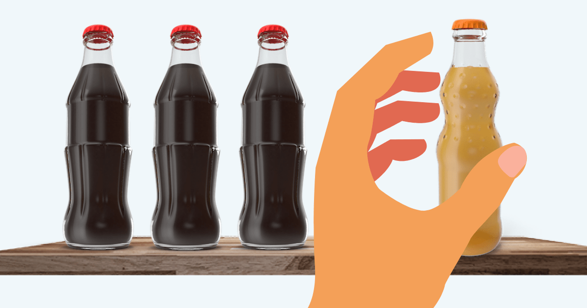 Person reaching past popular soda to grab less popular soda with cool packaging
