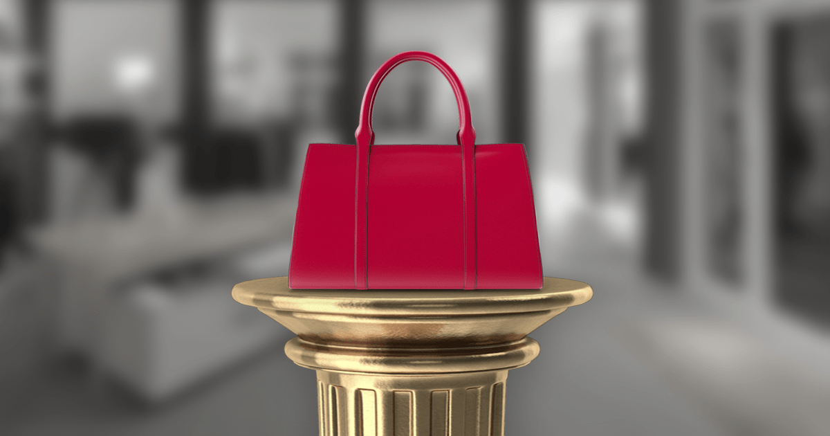 A luxury handbag isolated on a pedestal